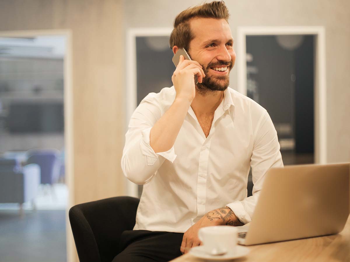 Bearded man on the phone for a free consultation